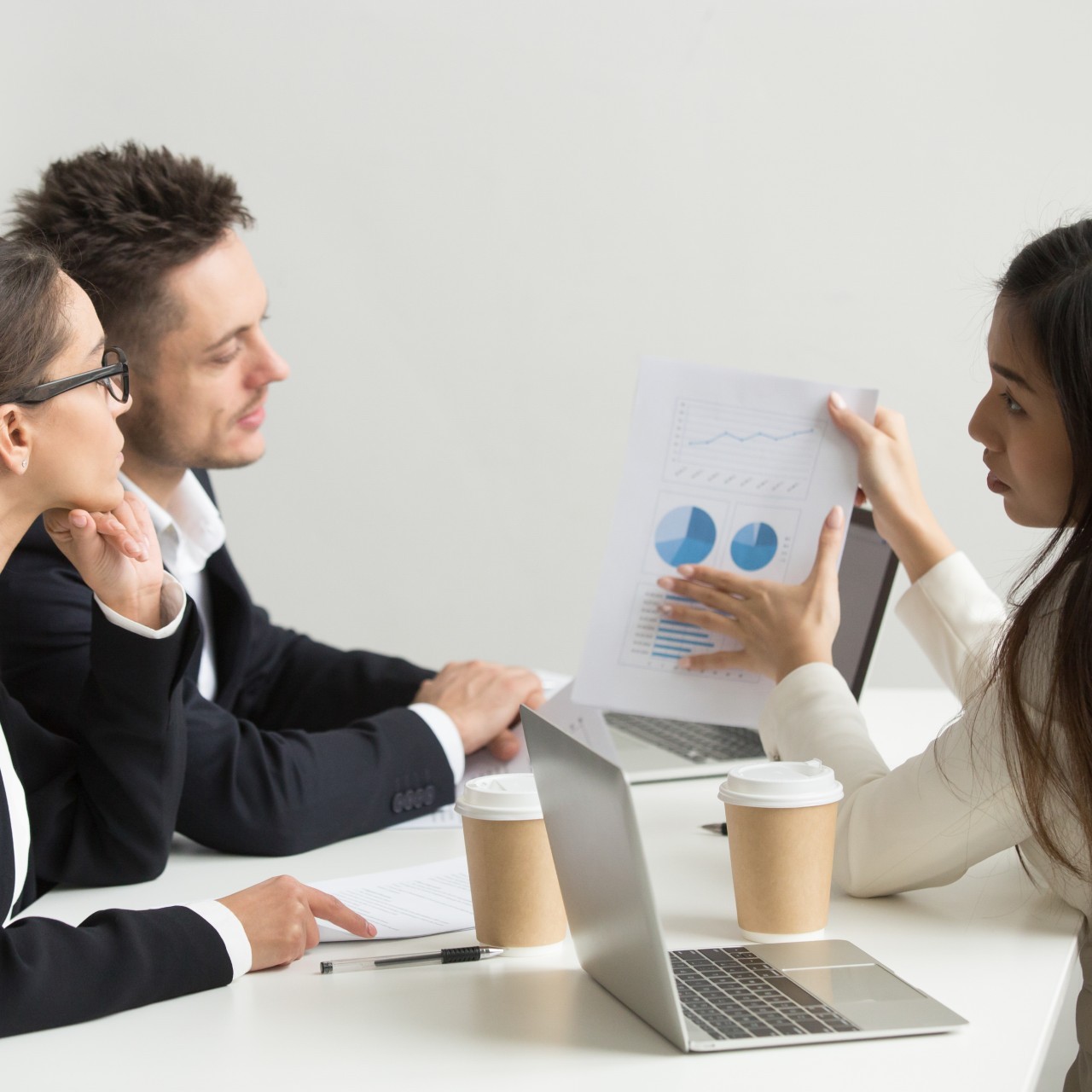 female-worker-presenting-visual-templates-coworkers